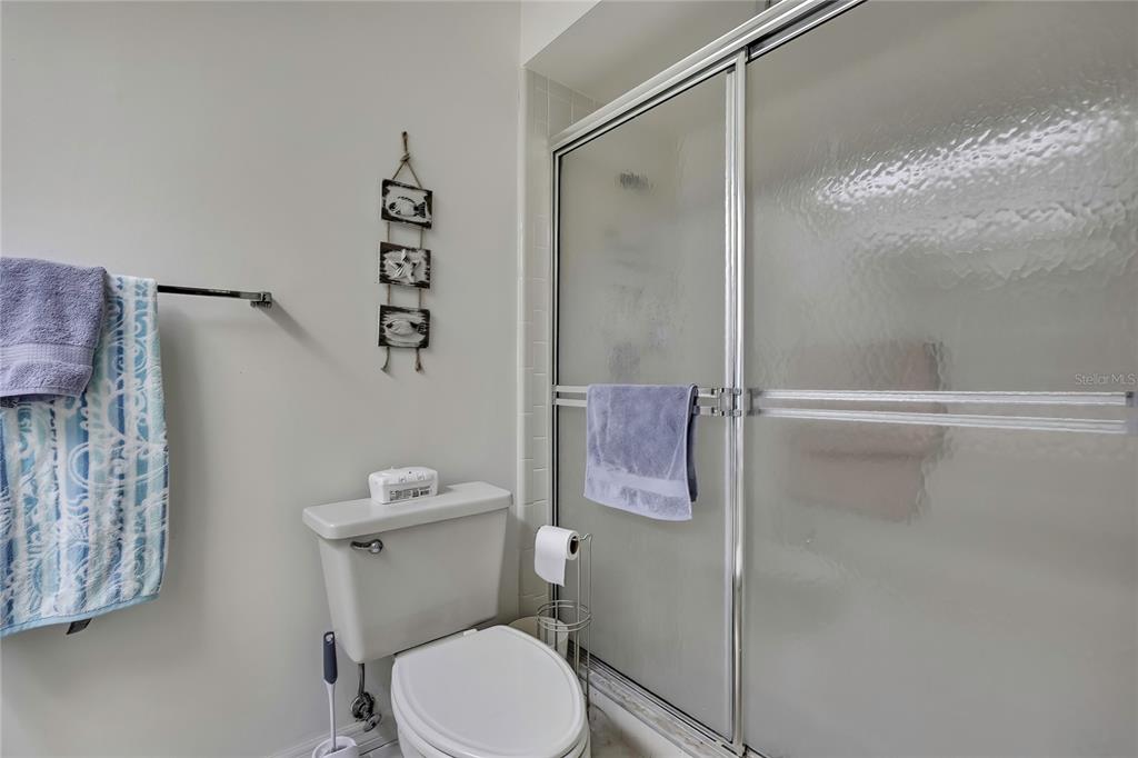 2111 Forester Way Spring Hill, FL 34606 - Photo 23 of 33 a white toilet sitting next to a bathroom sink