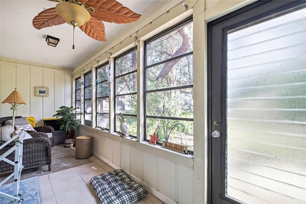 2111 Forester Way Spring Hill, FL 34606 - Photo 24 of 33 a living room with furniture and a large window