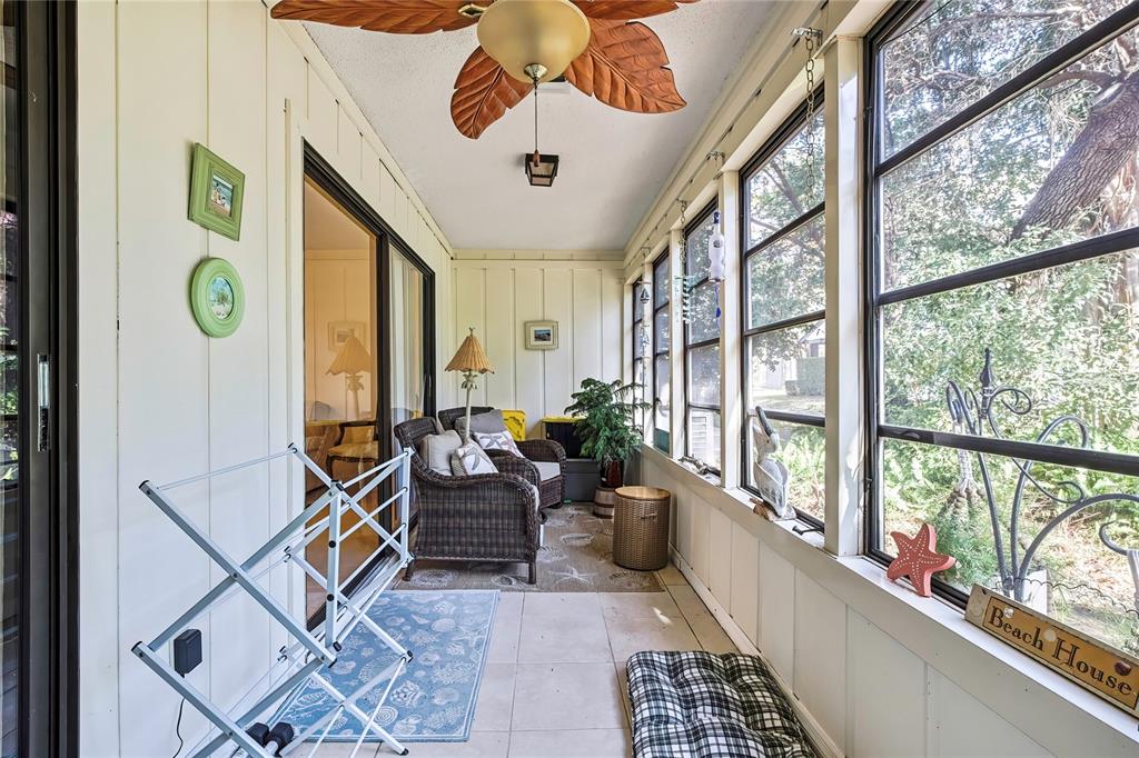 2111 Forester Way Spring Hill, FL 34606 - Photo 25 of 33 a living room with furniture and a large window