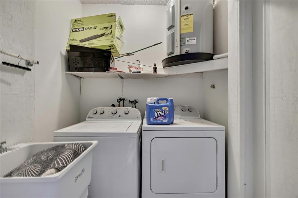 2111 Forester Way Spring Hill, FL 34606 - Photo 26 of 33 a utility room with dryer and washer