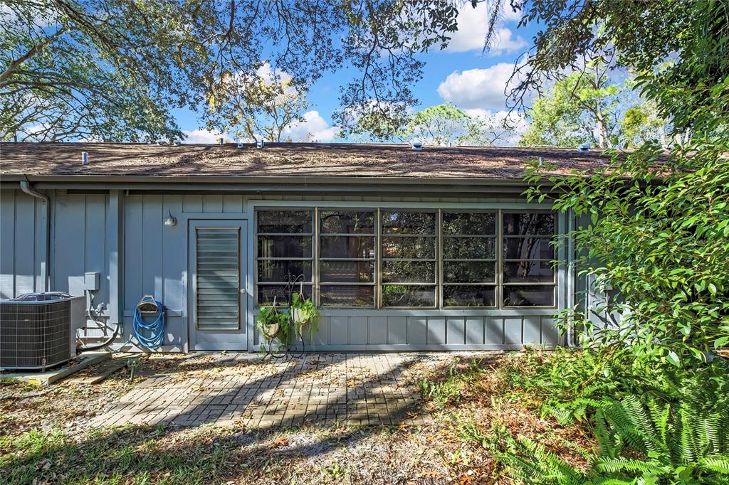 2111 Forester Way Spring Hill, FL 34606 - Photo 29 of 33 a front view of a house with a garden
