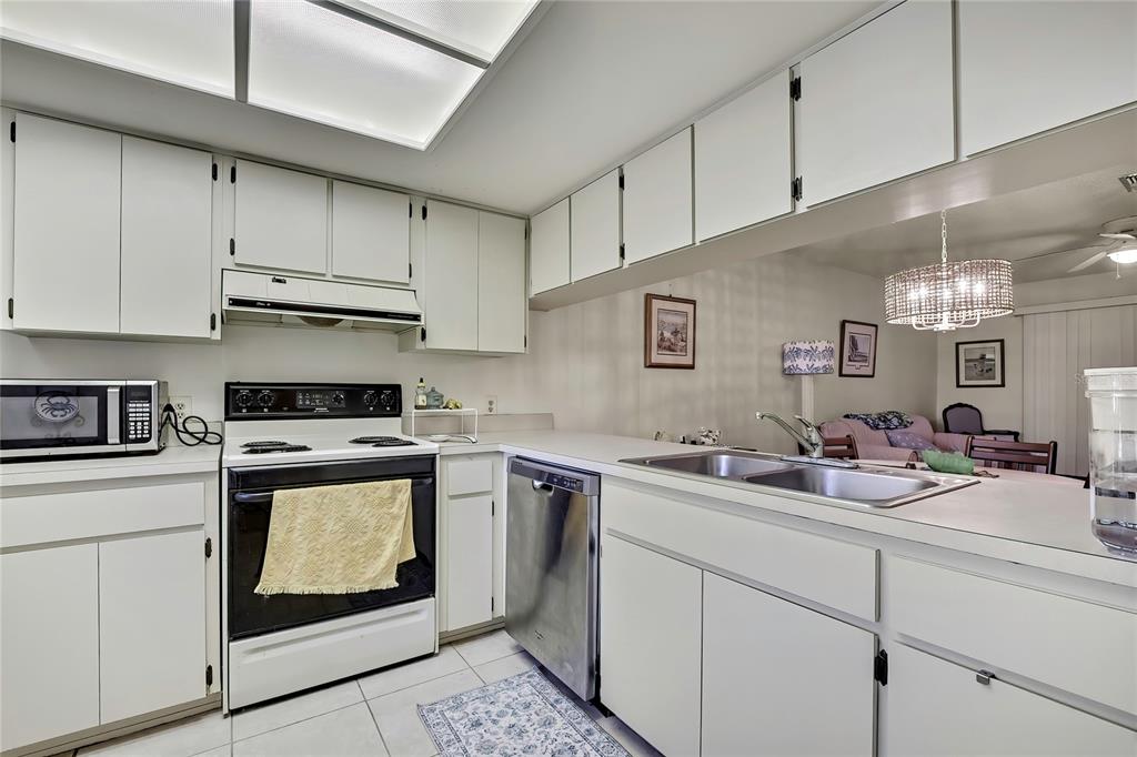 2111 Forester Way Spring Hill, FL 34606 - Photo 10 of 33 a kitchen with a sink stove and cabinets