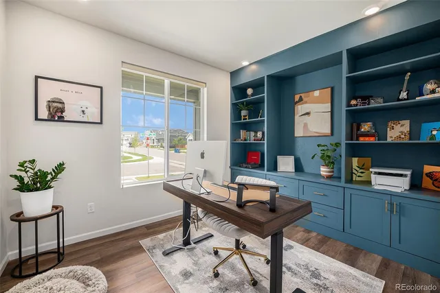 a workspace with furniture and window