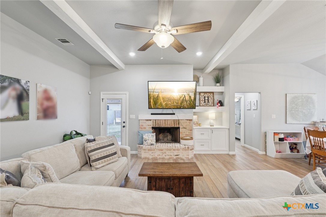 1522 Curlew Lane Temple, TX 76502 - Photo 2 of 35 a living room with furniture fireplace and flat screen tv