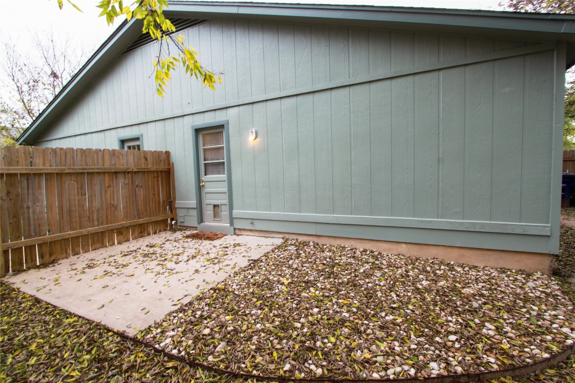 12609 Turtle Rock Road, Unit B Austin, TX 78729 - Photo 22 of 25 a view of a backyard