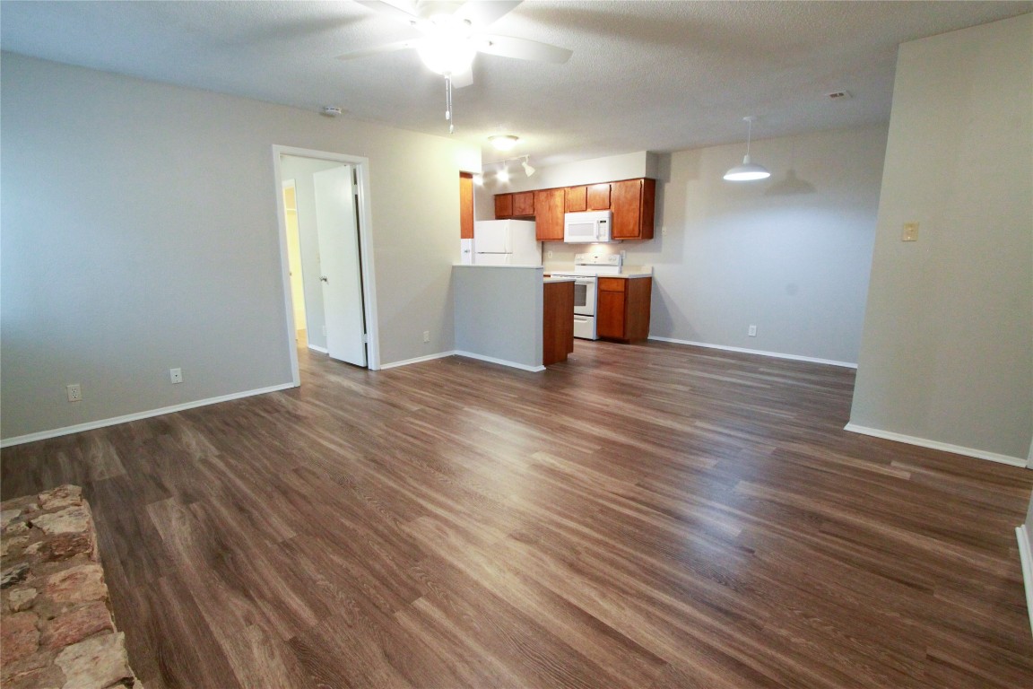 12609 Turtle Rock Road, Unit B Austin, TX 78729 - Photo 3 of 25 a view of a kitchen with a sink and a kitchen counter top