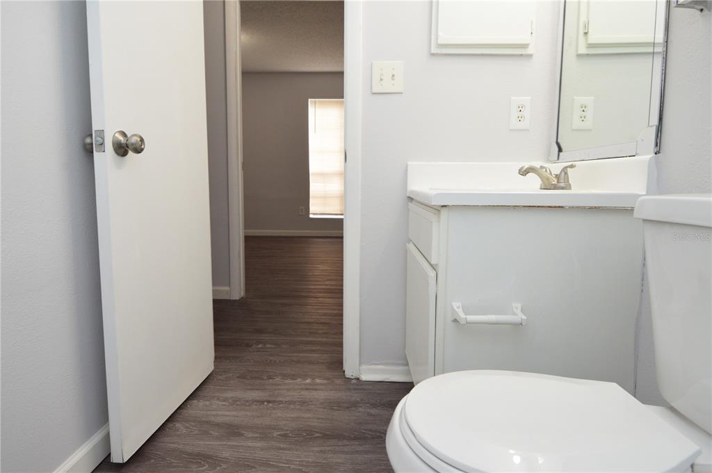 8641 Fancy Finch Drive, Unit 103 Tampa, FL 33614 - Photo 26 of 92 a bathroom with a sink a toilet and shower