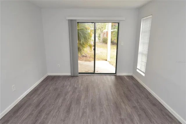 a view of a park with large trees