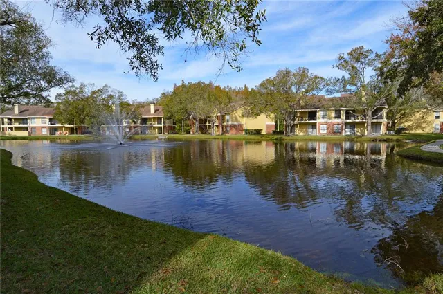 a front view of a house with swimming pool having outdoor seating