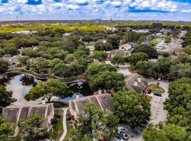 a view of a patio with table and chairs under an umbrella