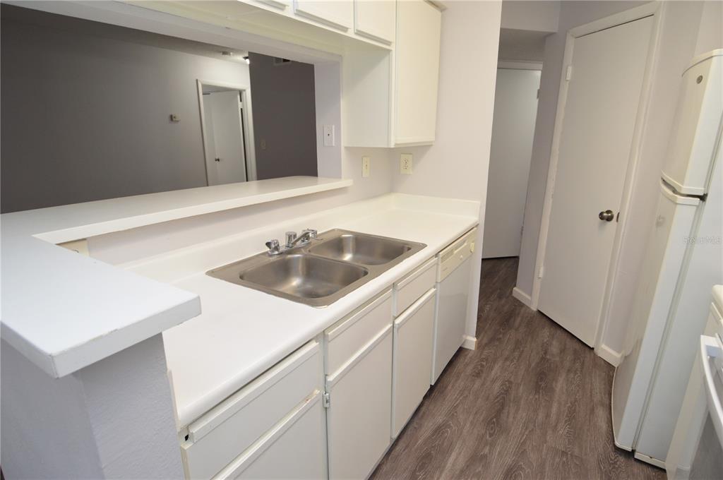 8641 Fancy Finch Drive, Unit 103 Tampa, FL 33614 - Photo 8 of 92 a bathroom with a sink and a mirror