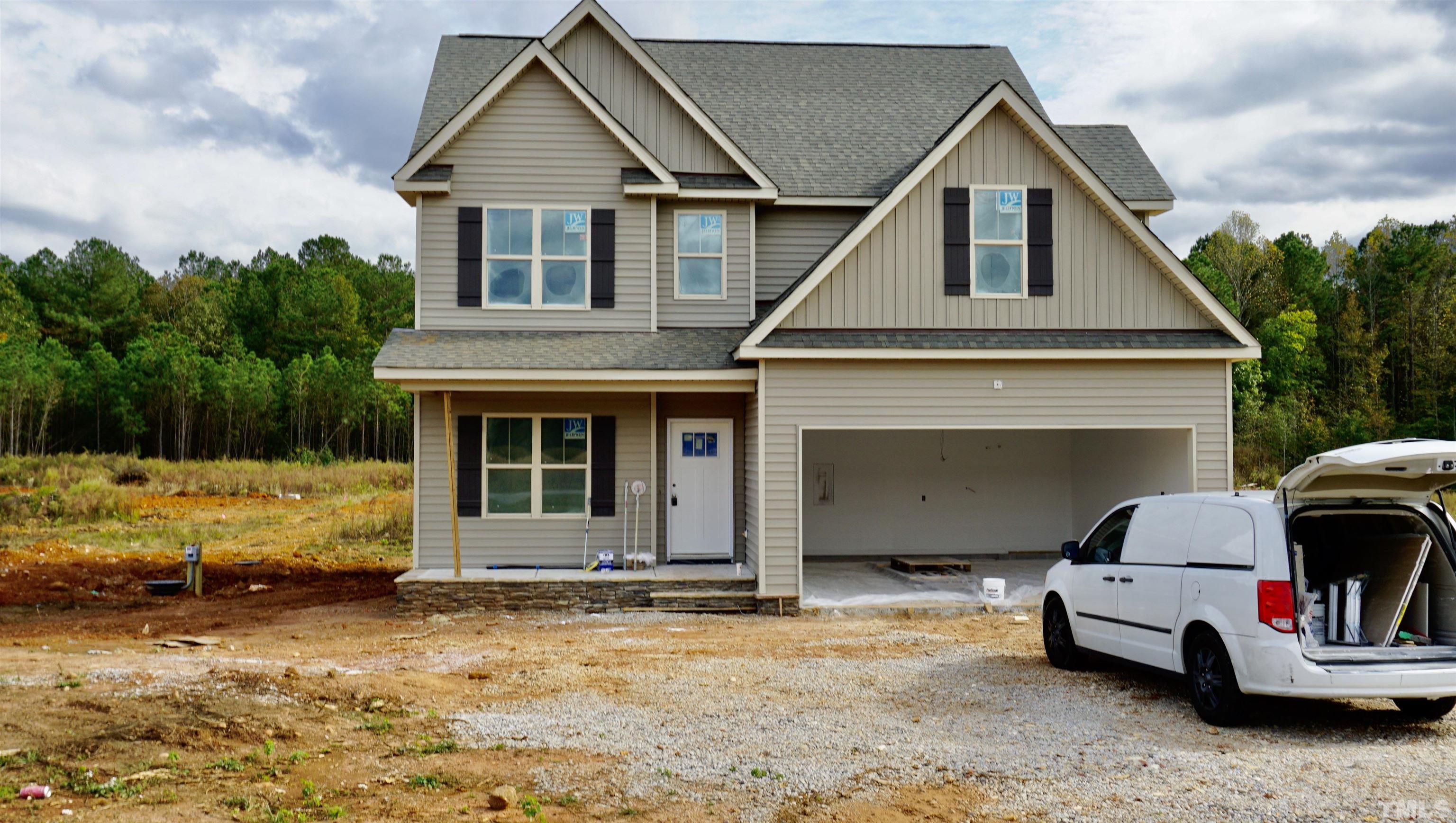 10541 West Old Spring Hope Road Spring Hope, NC 27882 - Photo 2 of 20 a front view of a house with parking space