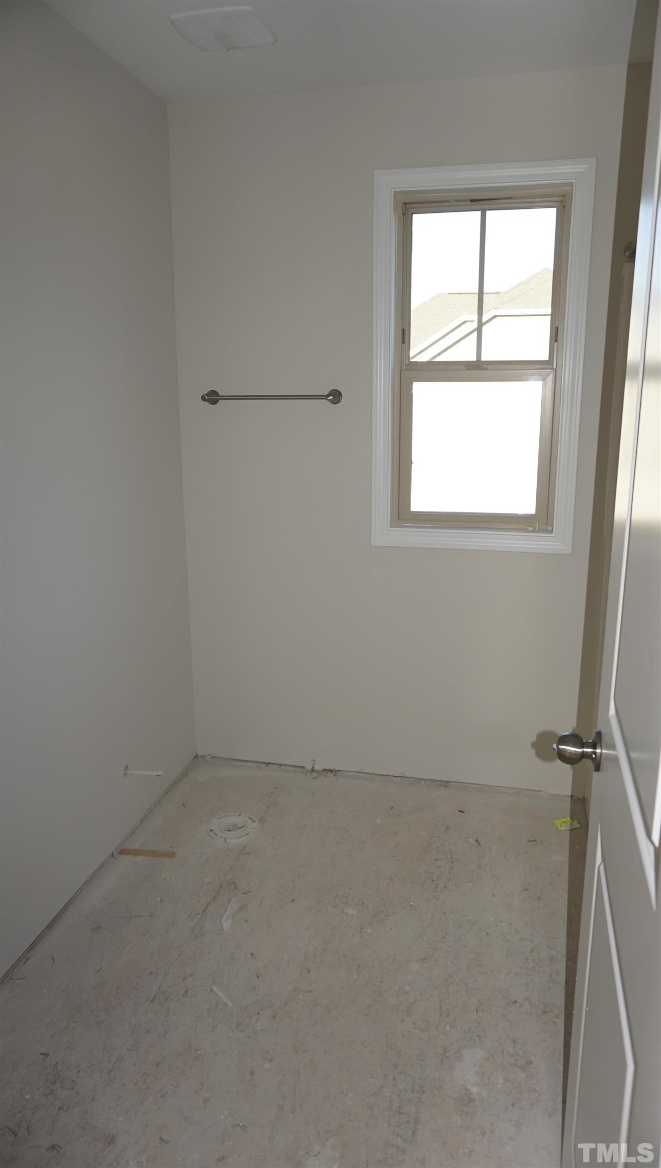 10541 West Old Spring Hope Road Spring Hope, NC 27882 - Photo 16 of 20 an empty room with a window