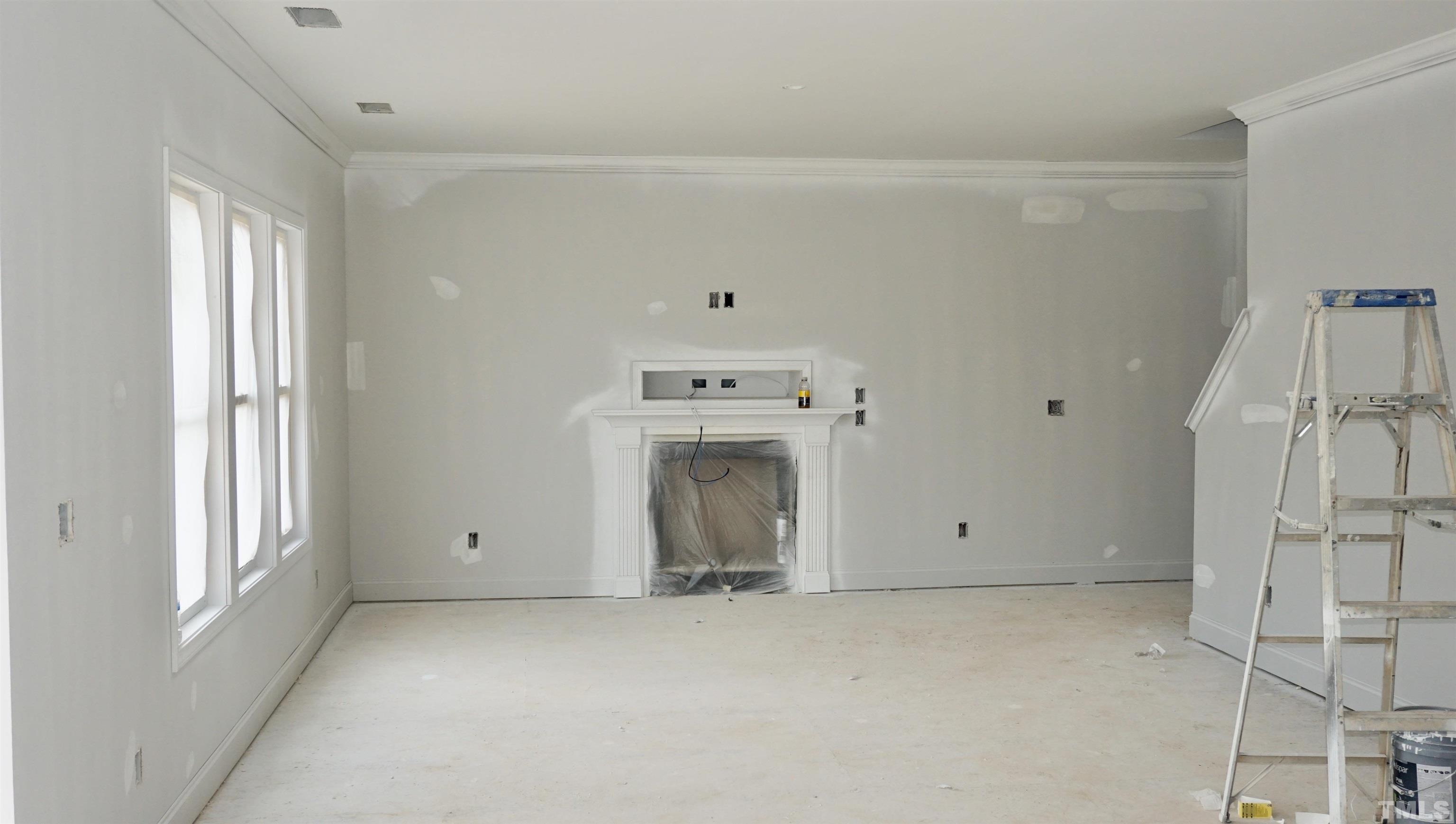 10541 West Old Spring Hope Road Spring Hope, NC 27882 - Photo 8 of 20 a view of an empty room with a fireplace and window