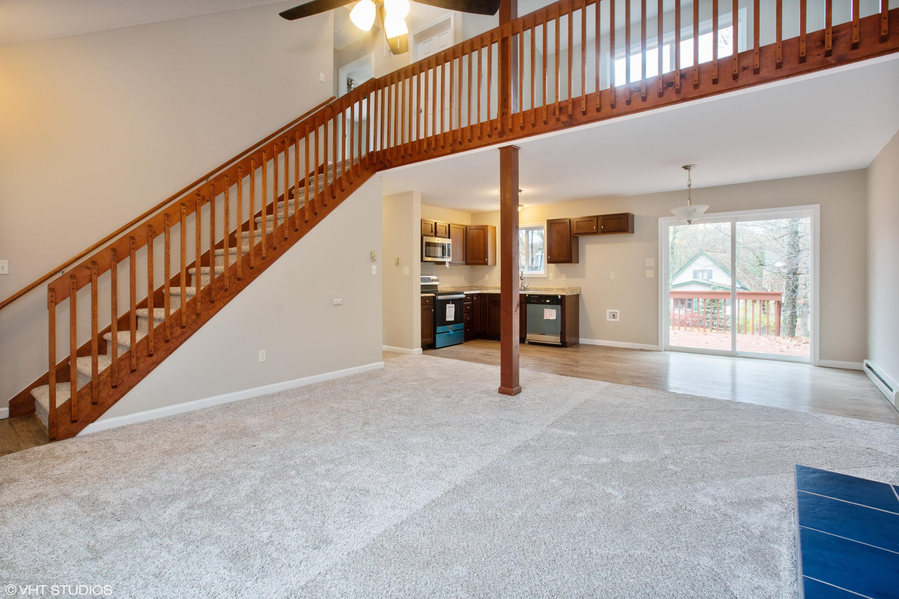 133 Roundhill Road Dingmans Ferry, PA 18328 - Photo 5 of 12 a view of an entryway with staircase