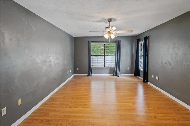 a view of an empty room with a window