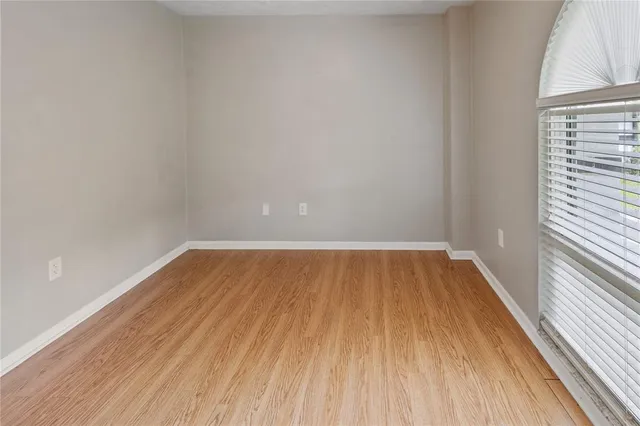 a view of an empty room and window