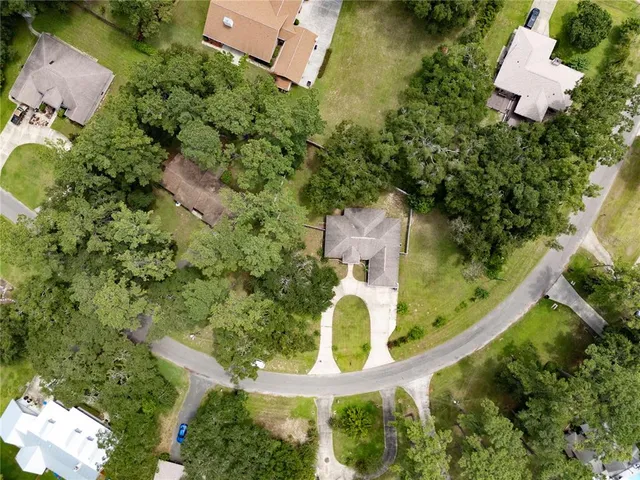 an aerial view of residential house with outdoor space and street view