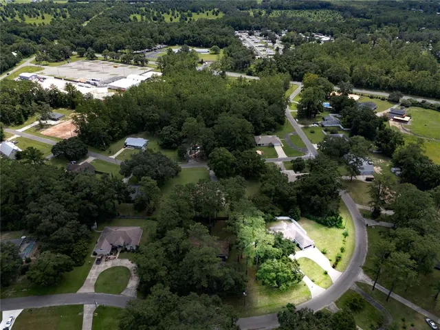 an aerial view of residential house with outdoor space and swimming pool
