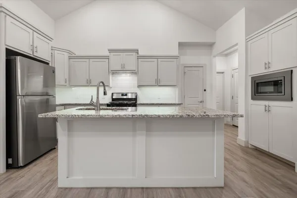 a bathroom with a sink a toilet and bathtub