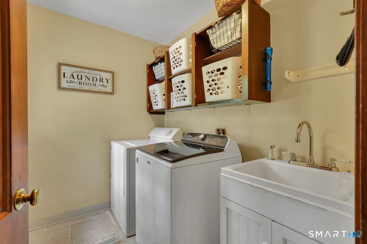 72 Old Post Road Wethersfield, CT 06109 - Photo 16 of 40 a bathroom with a sink and a mirror