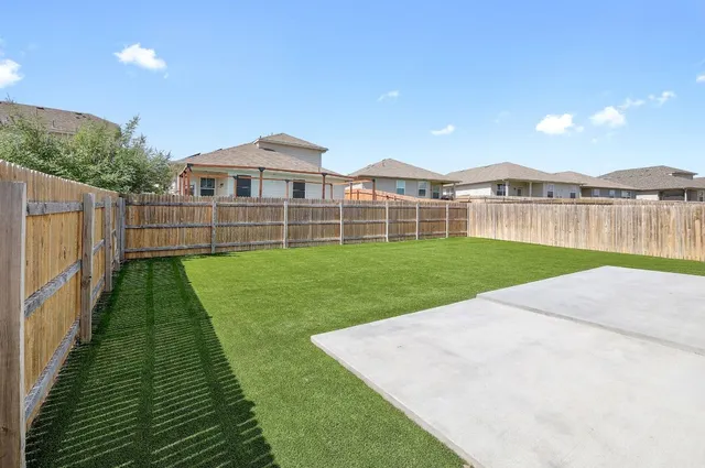 a view of a backyard with a garden and plants