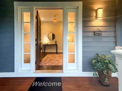 a potted plant sitting on a wooden table next to a window