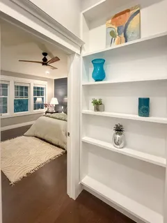 a bedroom with a bed and lamp