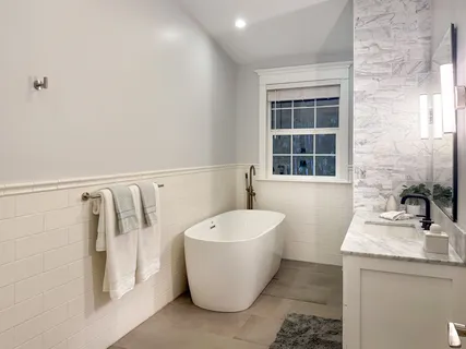 a bathroom with a bathtub and a sink
