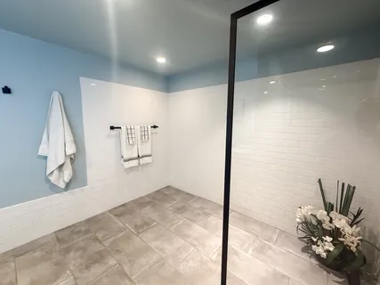 a view of a hallway to a room with a potted plant