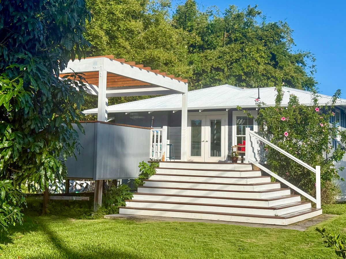 56 Nanea Street Hilo, HI 96720 - Photo 26 of 29 a view of a house with a yard and sitting area