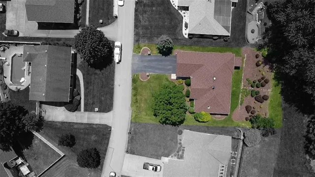 an aerial view of a house with garden