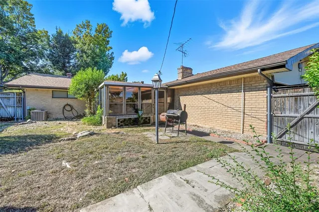 a house view with a backyard space
