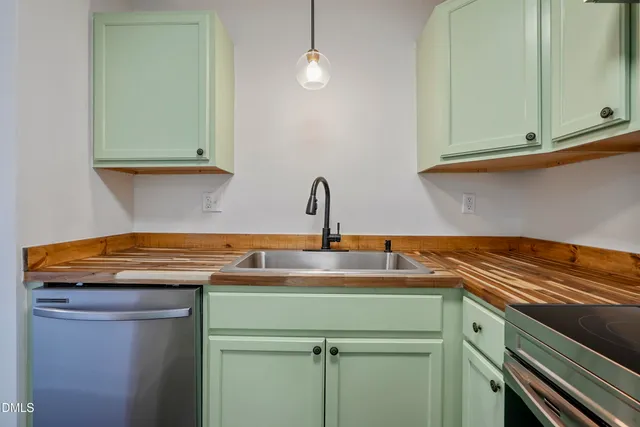 a kitchen with a sink and cabinets