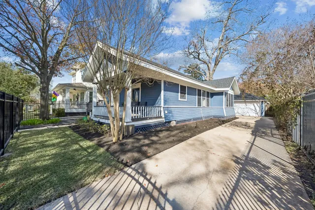 a view of a house with a yard covered in snow