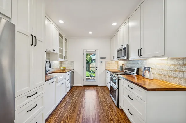 a very nice looking dining room with a large window