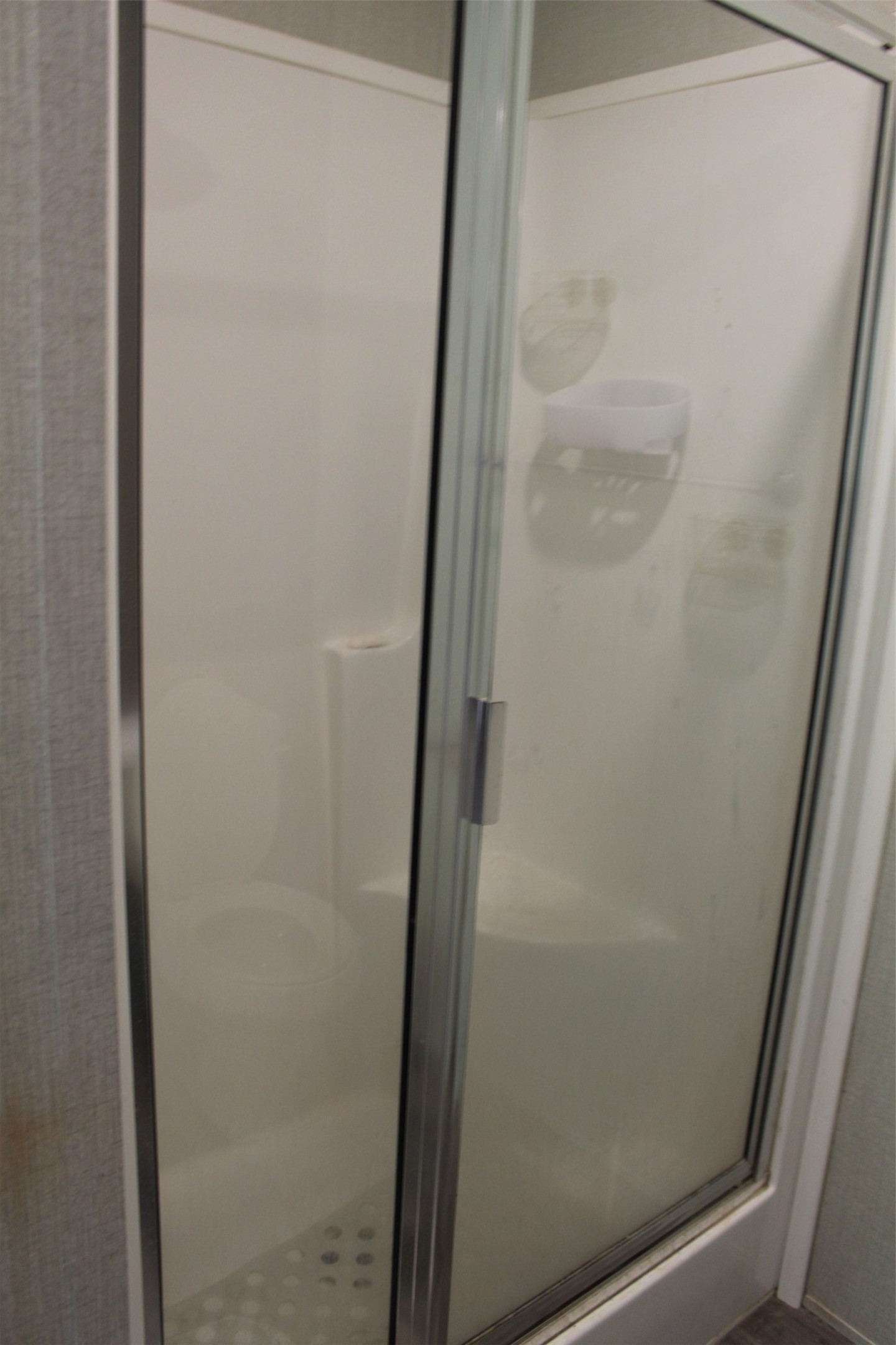 555 Beaver Run Grapeland, TX 75844 - Photo 19 of 21 a bathroom with a glass door
