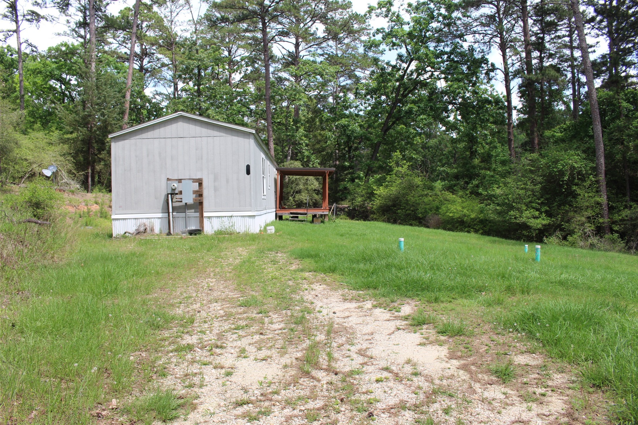 555 Beaver Run Grapeland, TX 75844 - Photo 2 of 21 a view of a house with backyard and garden