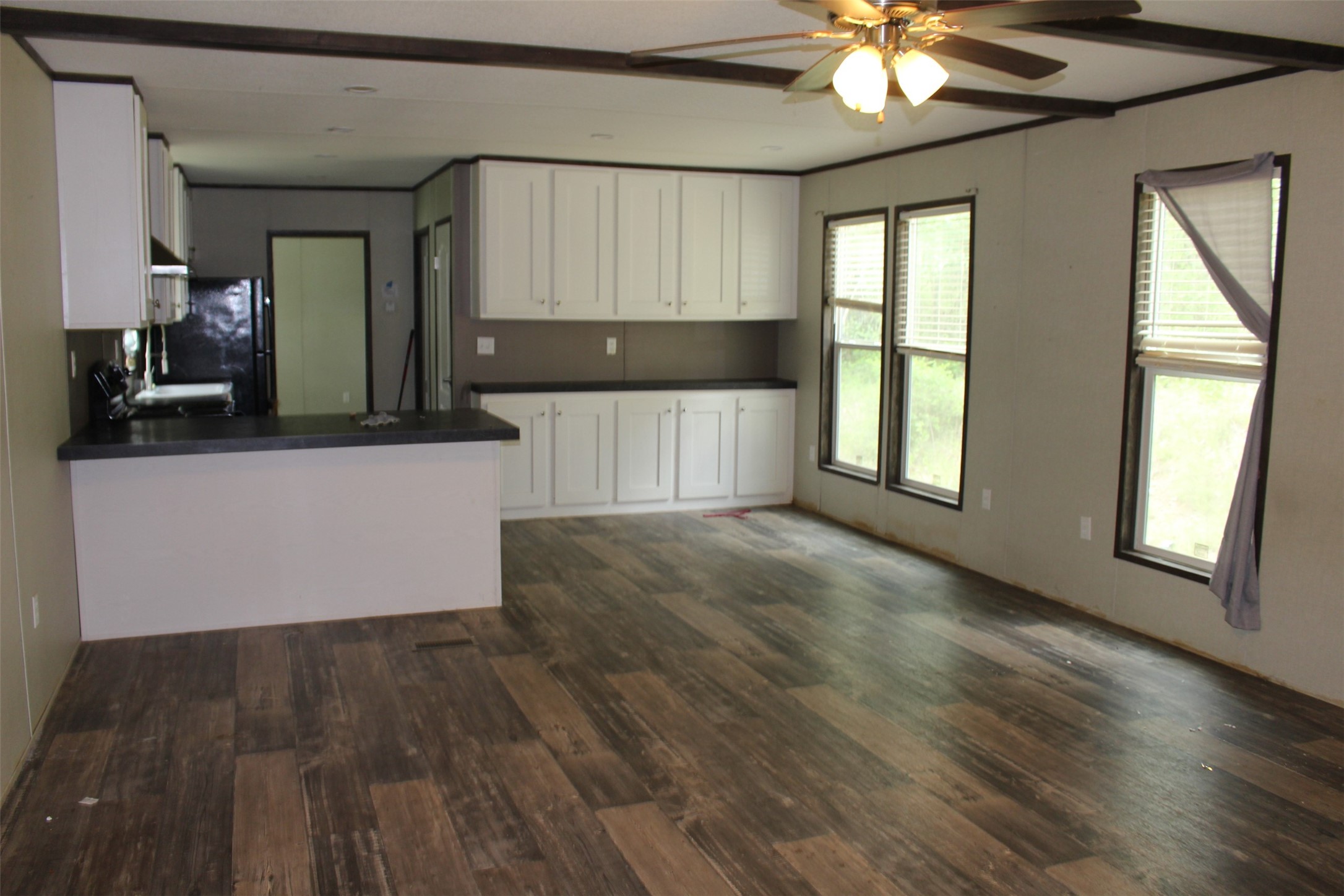 555 Beaver Run Grapeland, TX 75844 - Photo 4 of 21 a view of a kitchen cabinets and a wooden floor