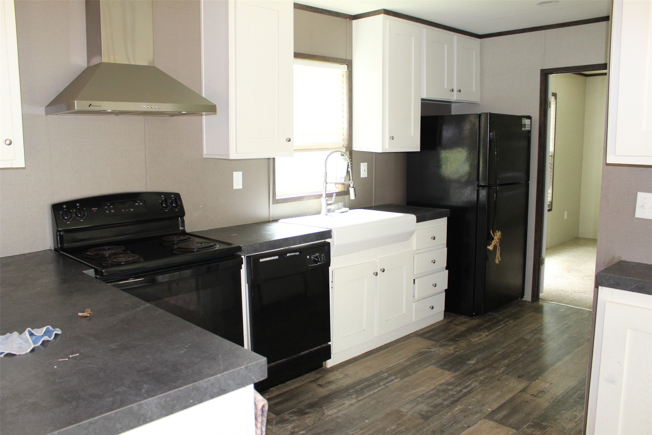 555 Beaver Run Grapeland, TX 75844 - Photo 8 of 21 a kitchen with a refrigerator and a stove
