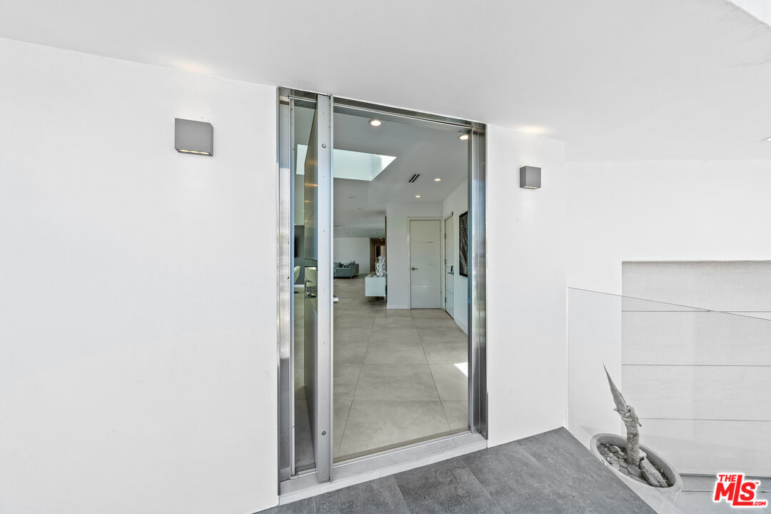 849 Glenmere Way Los Angeles, CA 90049 - Photo 3 of 51 a view of a bathroom from the hallway