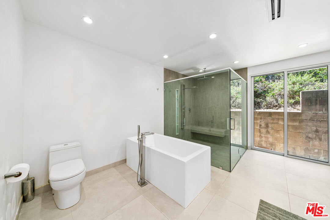 849 Glenmere Way Los Angeles, CA 90049 - Photo 37 of 51 a bathroom with a toilet sink and shower