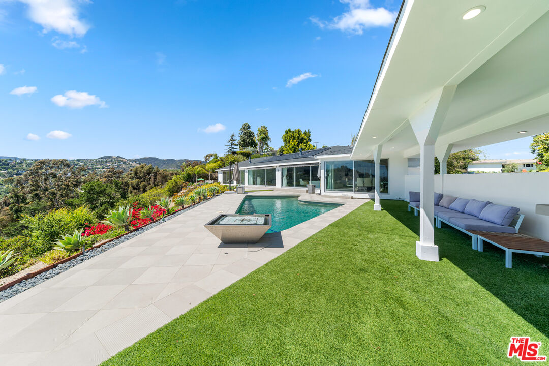 849 Glenmere Way Los Angeles, CA 90049 - Photo 40 of 51 a view of an house with backyard space and garden