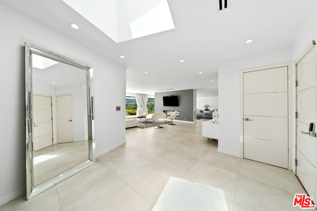 849 Glenmere Way Los Angeles, CA 90049 - Photo 5 of 51 a view of a living room and a flat screen tv