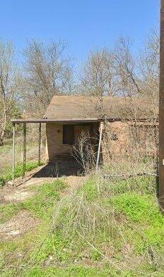 431 Well Street Marlin, TX 76661 - Photo 2 of 6 a view of house with backyard and trees
