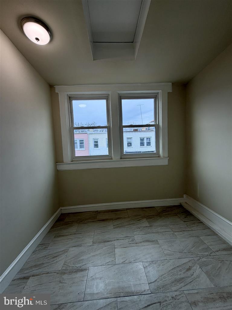 1154 4th Street Northeast Washington, DC 20002 - Photo 16 of 24 an empty room with wooden floor and windows