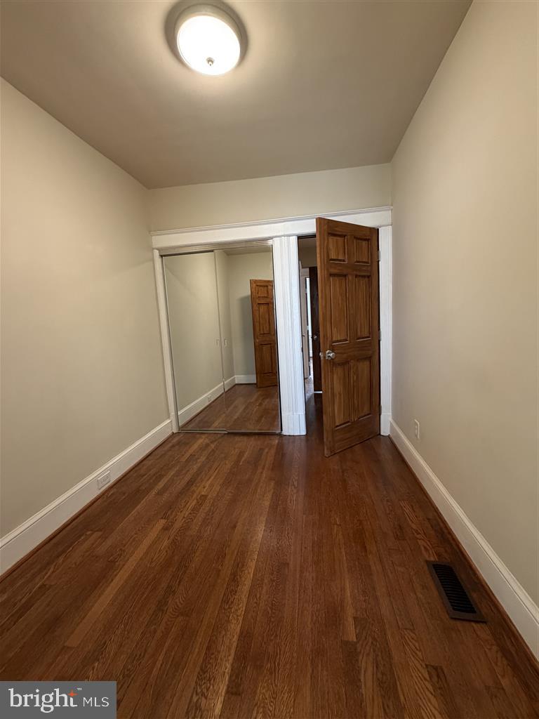 1154 4th Street Northeast Washington, DC 20002 - Photo 17 of 24 a view of an empty room with wooden floor