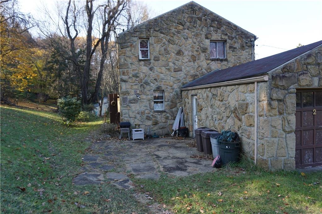 253 Byron Road Pittsburgh, PA 15237 - Photo 5 of 16 Cement walkway and patio lead from the garage to the back door.