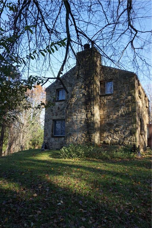 253 Byron Road Pittsburgh, PA 15237 - Photo 7 of 16 Beautiful stone chimney facing the large side yard.