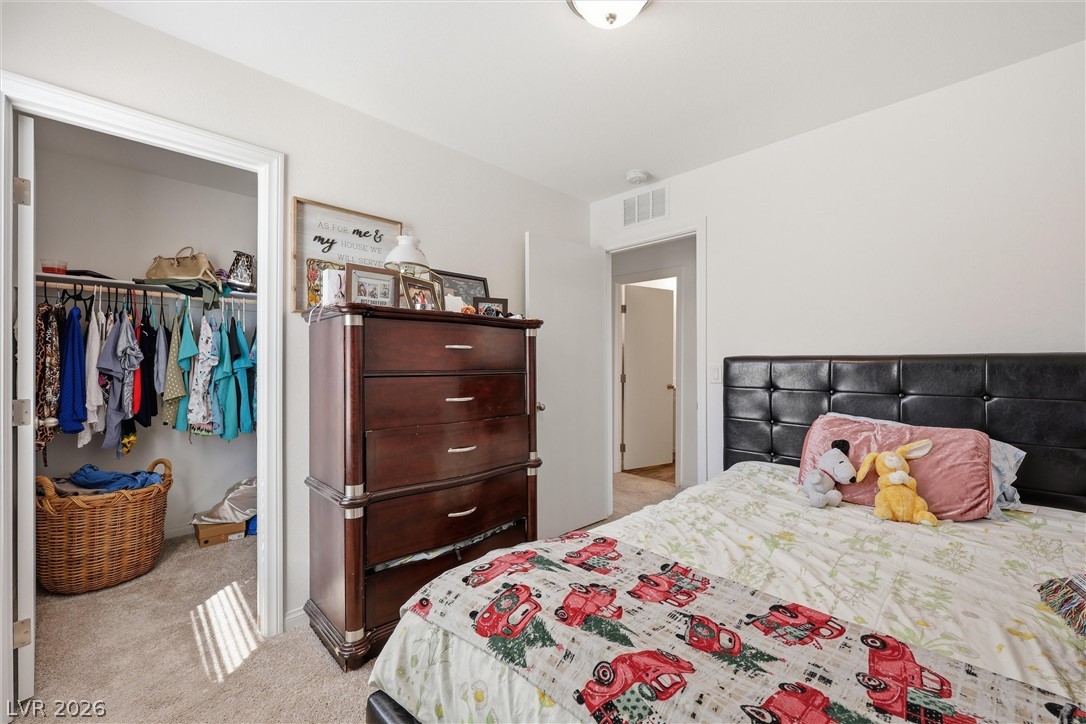 1811 Lincoln Road Las Vegas, NV 89115 - Photo 20 of 30 Bedroom featuring light colored carpet